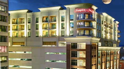 Hampton Inn building at night.